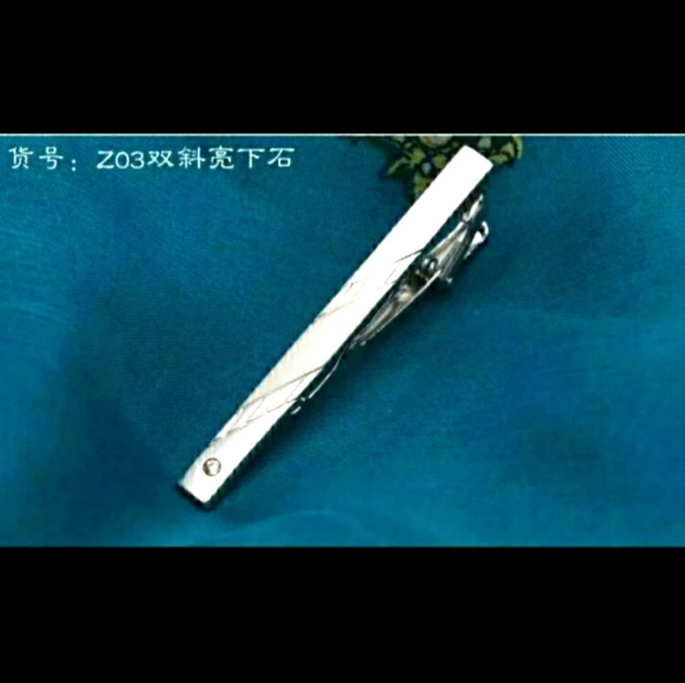Men's silver tie pin with button hook
